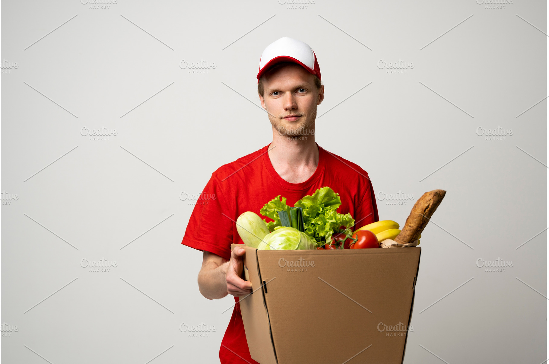 Deliver man wearing red uniform, a Person Photo by volodymyrshtun13795