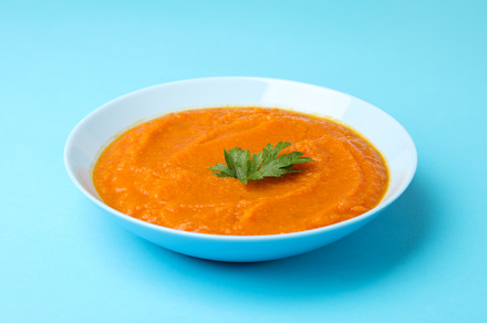 Plate with pumpkin puree and parsley on blue background, a Food & Drink Photo by AtlasStudio PRO