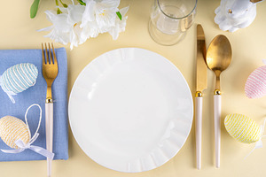 Cute Easter table setting with bunny, Easter egg, napkin and sp, a Holiday Photo by Rimma