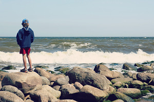 Boy looking at sea, a Person Photo by BOOCYS