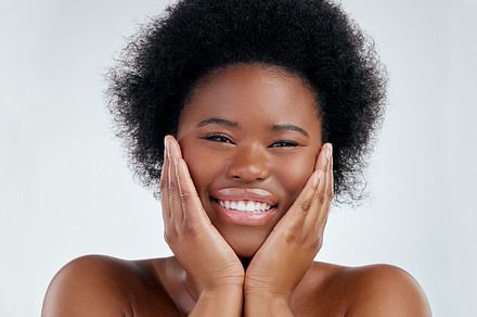 Wellness, beauty and portrait of a woman in studio with a natural, skincare or cosmetic face routine. Health, young and headshot of an African female model with facial dermatology by gray background., a Photo by Peopleimages.com
