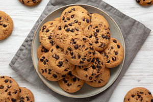 Homemade Chocolate Chip Cookies on a Plate, top view., a Food & Drink Photo by LiudmylaChuhunova