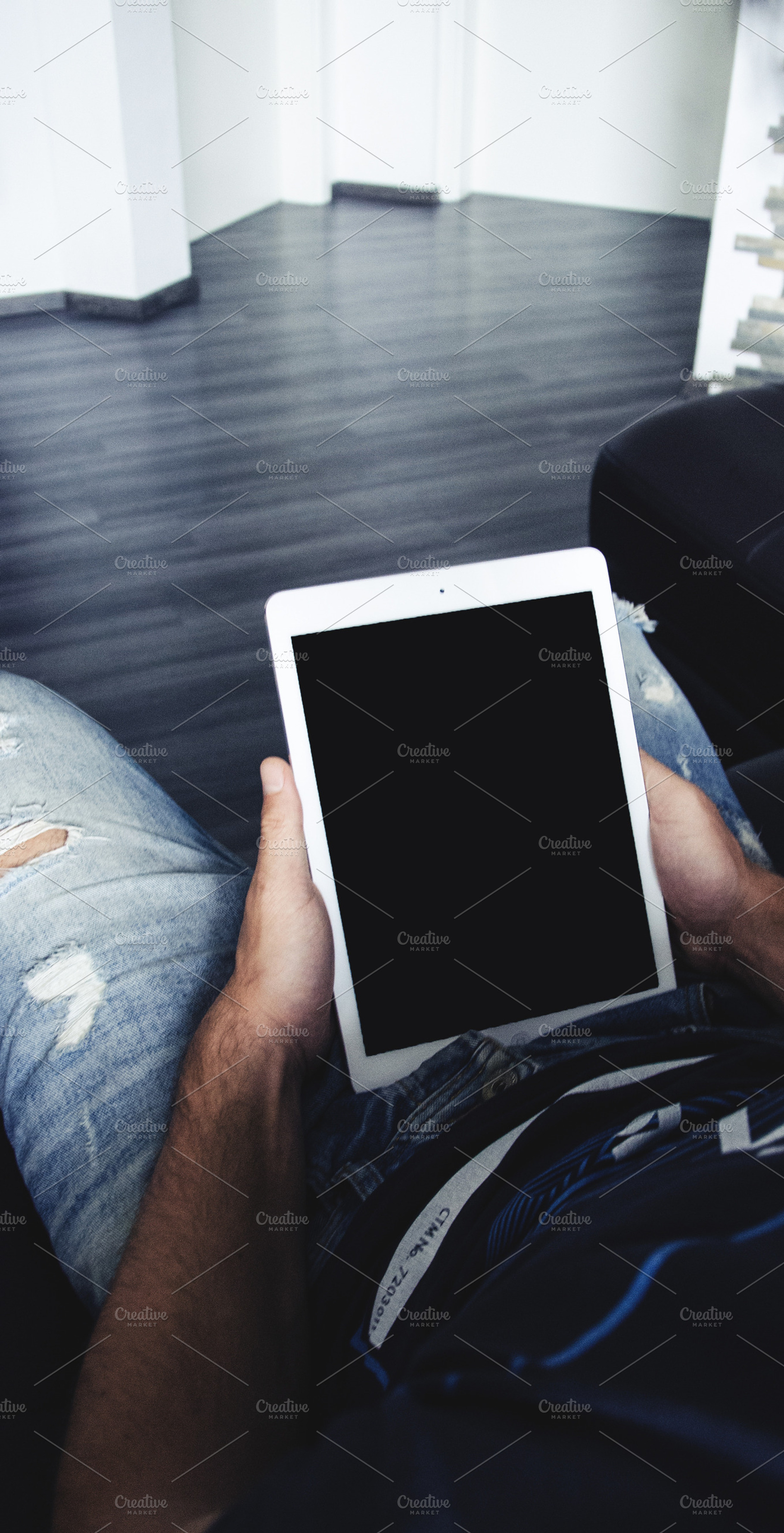 Man holding a white ipad stock photo containing mac and macbook