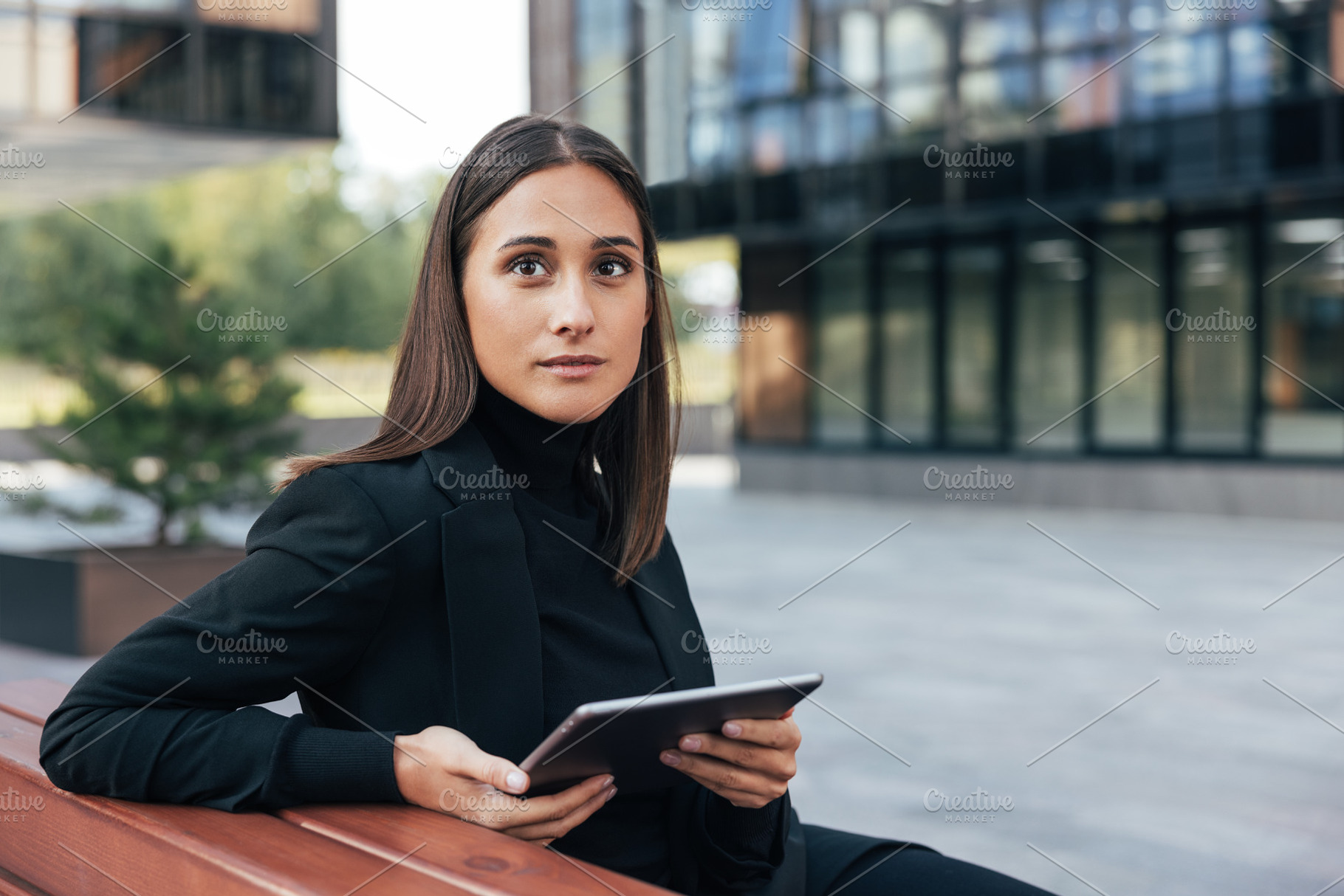 Young brunette with digital tablet, a Business Photo by Artem Varnitsin