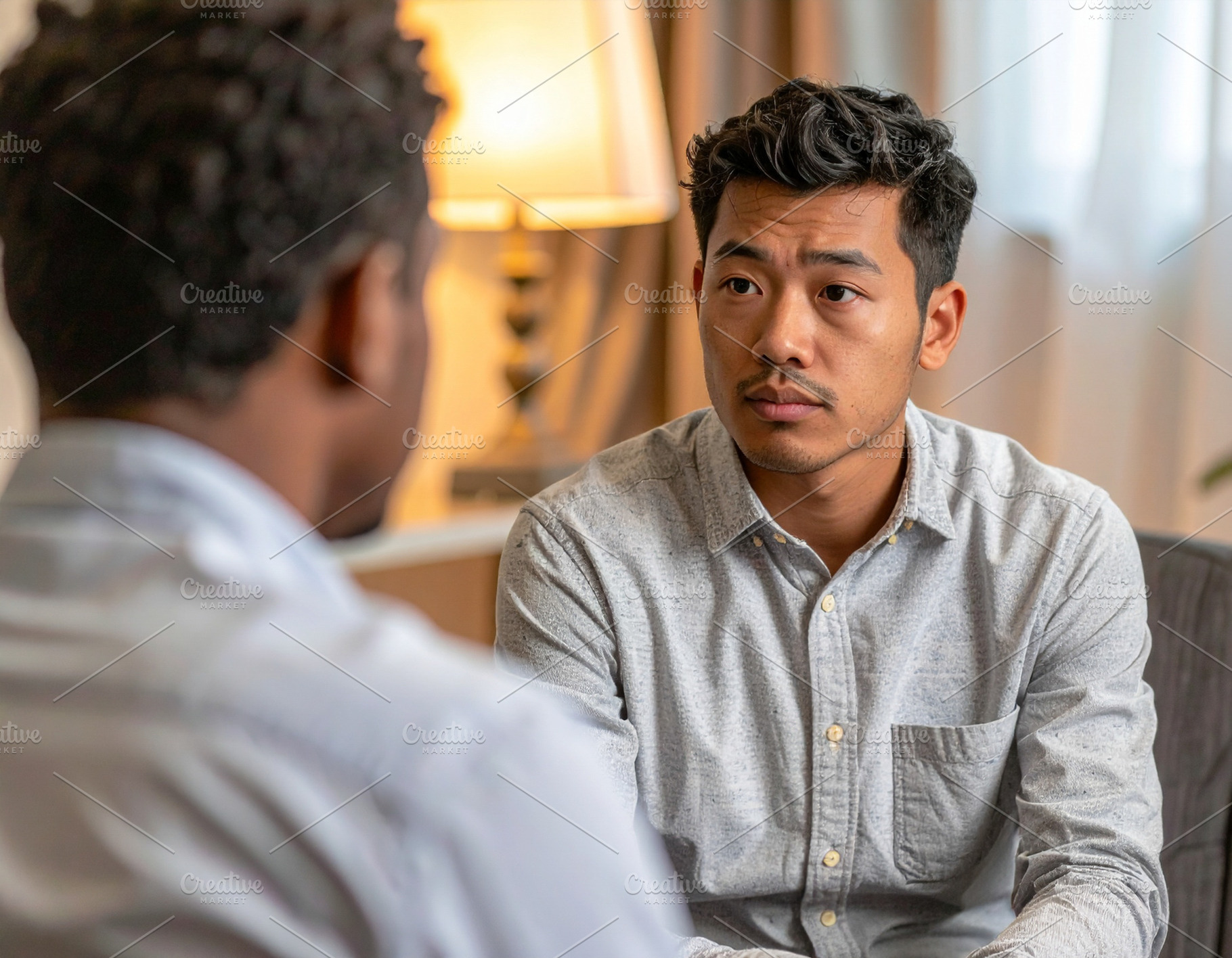Real photo of a psychologist speaking with a patient in a therap, a Health & Medical Photo by DanFLCreativo