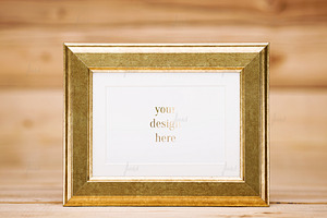 Golden frame on wood background, a Print Template by JustLikeMyDesktop