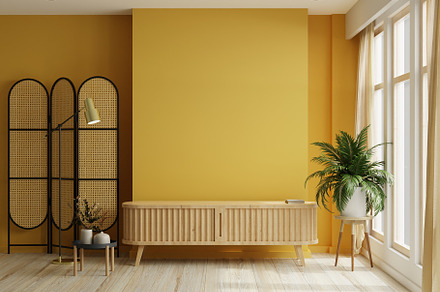 Yellow room with wooden cabinet for tv interior mockup wall.