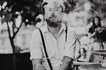 Young bearded man in a cafe, a Person Photo by EVA.studio