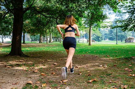 Female athlete running through a park, a Sports & Recreation Photo by davidpereiras