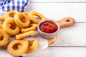 Golden onion rings with ketchup sauce, a Food & Drink Photo by Rimma