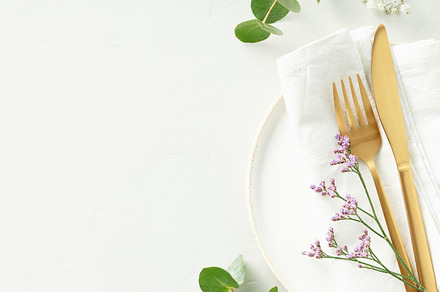 Gold Cutlery with eucalyptus branches on white plate with napkin, a Food & Drink Photo by Natalia Klenova's Shop