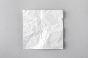 Square crumpled white paper on a clean gray background, top view, a Background Photo by Ales Munt