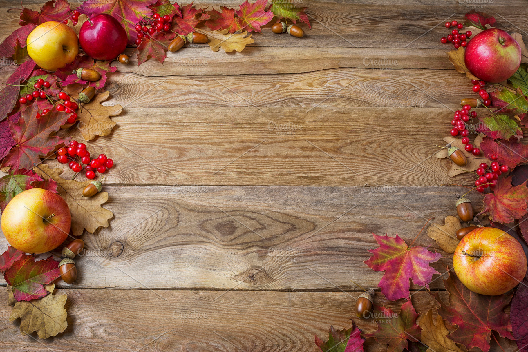 Frame of apples, acorns, berries, a Background Photo by TasiPas