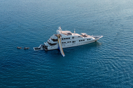 Big luxury white yacht anchoring in