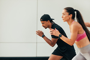 Two athletes prepare to run, a Sports & Recreation Photo by Artem Varnitsin