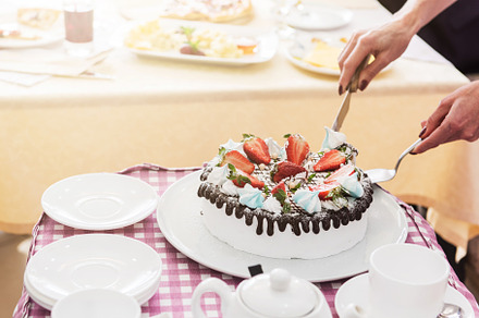 Tasty strawberry cream cake featuring teapot, slice, and sugar, a Food & Drink Photo by Jan Jack Russo Media