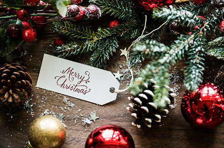 Christmas concept containing baubles, card, and celebrate