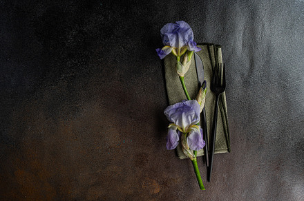 Table setting with pale blue iris flowers