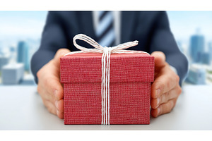 A business man is shown holding a, a Holiday Photo by ZinetroN