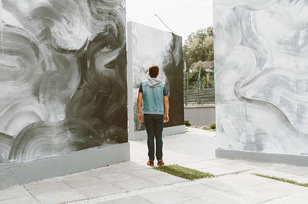 Man Looking on Street Art Space