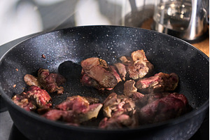 Sliced liver sizzles in a pan with, a Food & Drink Photo by darksoul72