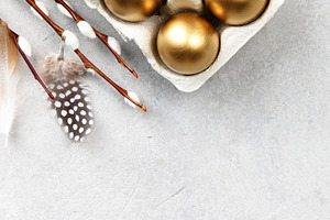 Golden Easter Eggs with Willow Branches on Light Background, a Holiday Photo by Natalia Klenova's Shop