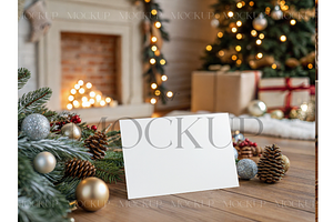 Festive 5x7 Card Among Pine Cones, a Product Mockup by MockupWizard