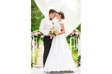 Wedding couple under the flower arch, a Person Photo by oksix