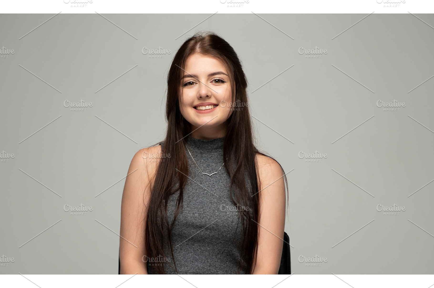 Happy young woman smiling, sitting, a Person Photo by volodymyrshtun13795