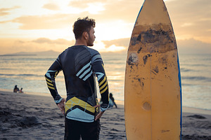 Surfer Watching Sunset at the Beach, a Sports & Recreation Photo by bastera