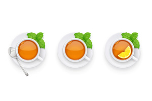 Tea cup and green leaf on plate.