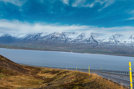 Highway road and mountain view during auto trip in Iceland. Spec, a Nature Photo by YuriyB