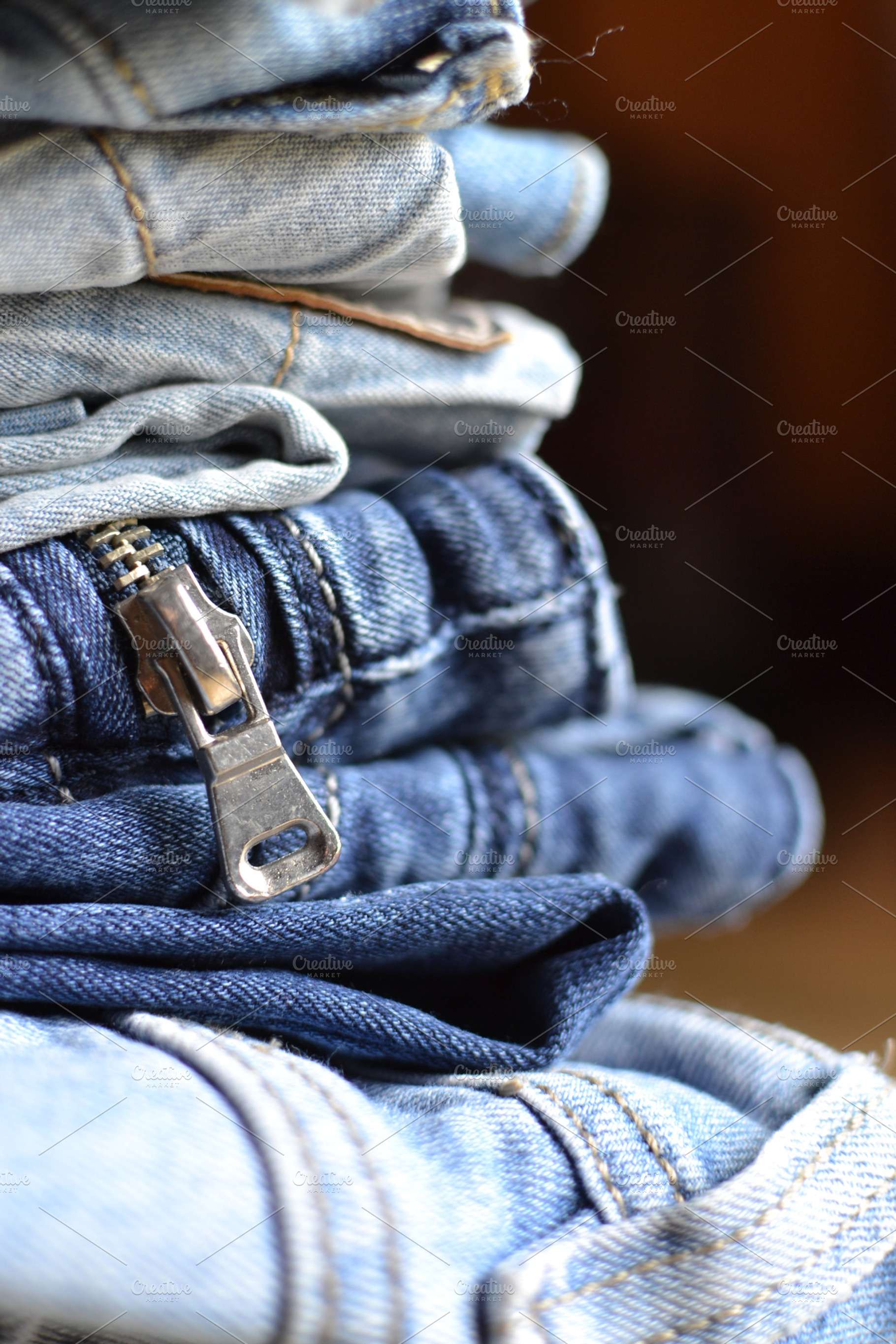 Stack of folded jeans stock photo containing denim and fabric