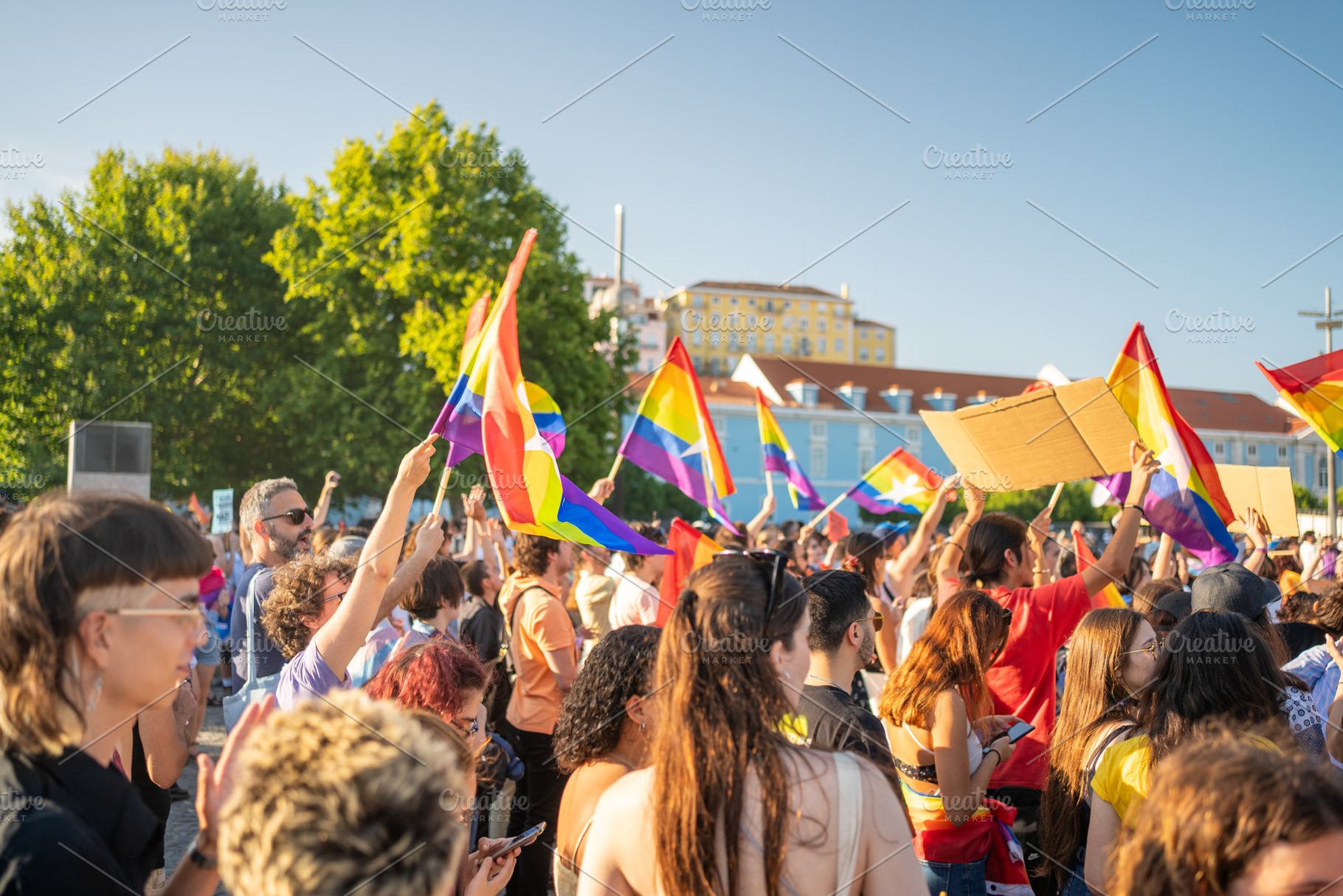 Crowd of homosexual people with rainbow flags at gay pride parade, a Person Photo by andreonegin market