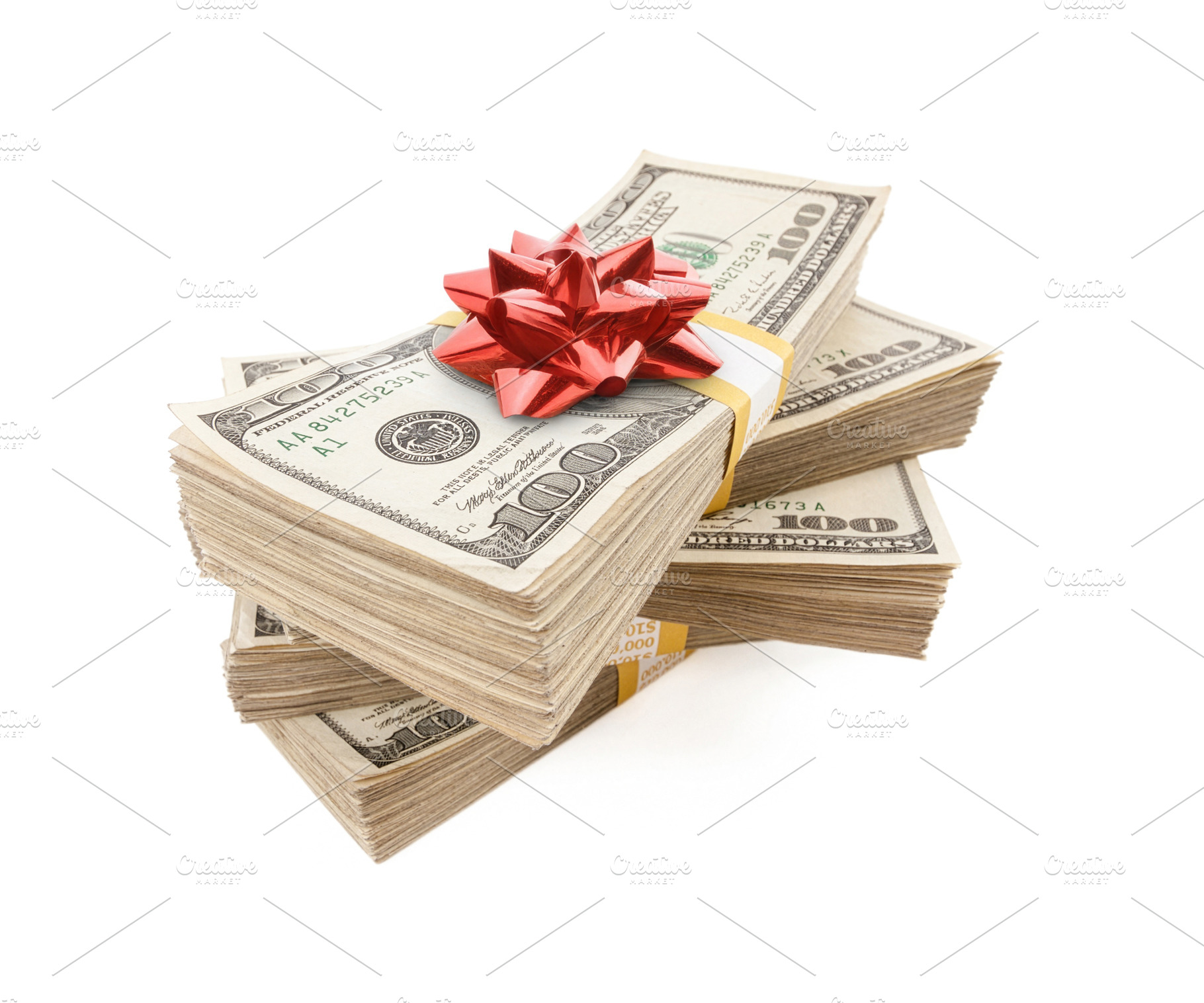 Stacks of One Hundred Dollar Bills with Red Bow On Top., a Business Photo by Andy Dean Photography