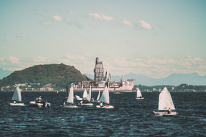Sailboats with distant offshore rig, an Industrial Photo by SkyNext