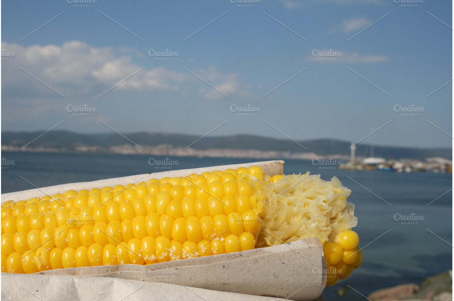 Fresh yellow corn cob with sea and, a Food & Drink Photo by Lermont51