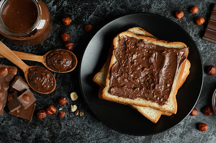 Concept of delicious food with chocolate paste on black smokey b, a Food & Drink Photo by AtlasStudio PRO