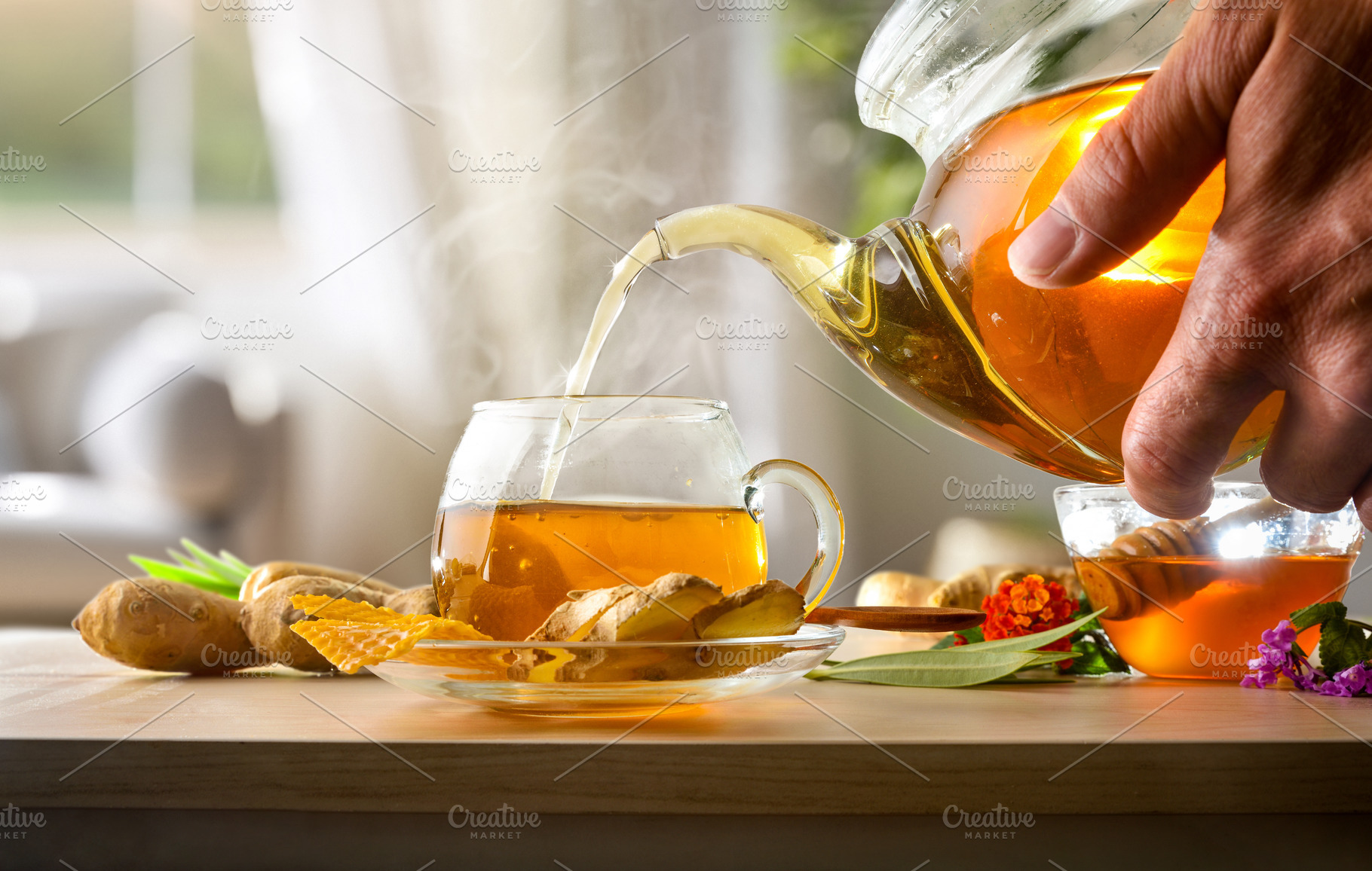 Serving cup of ginger infusion with honey on living room, a Food & Drink Photo by Davizro's Market