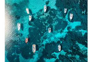 Aerial view of boats anchored in, a Transportation Photo by den-belitsky