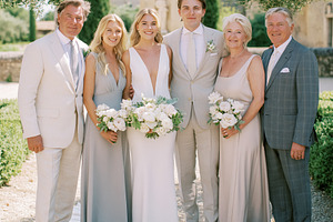 Wedding party celebrating outdoors, bride and groom with parents, a Person Photo by Studio ANNA