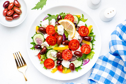 Traditional greek salad with feta cheese, kalamata olives, tomat, a Food & Drink Photo by 5PH