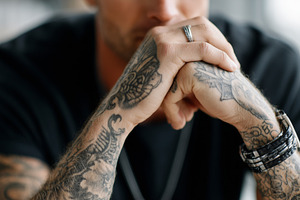 Close up of thoughtful tattooed man, a Person Photo by MistyDay