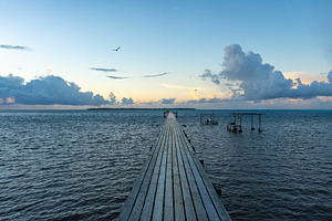 Sunset over the tranquil lagoon of Maupiti, French Polynesia, a Nature Photo by GoodGoods