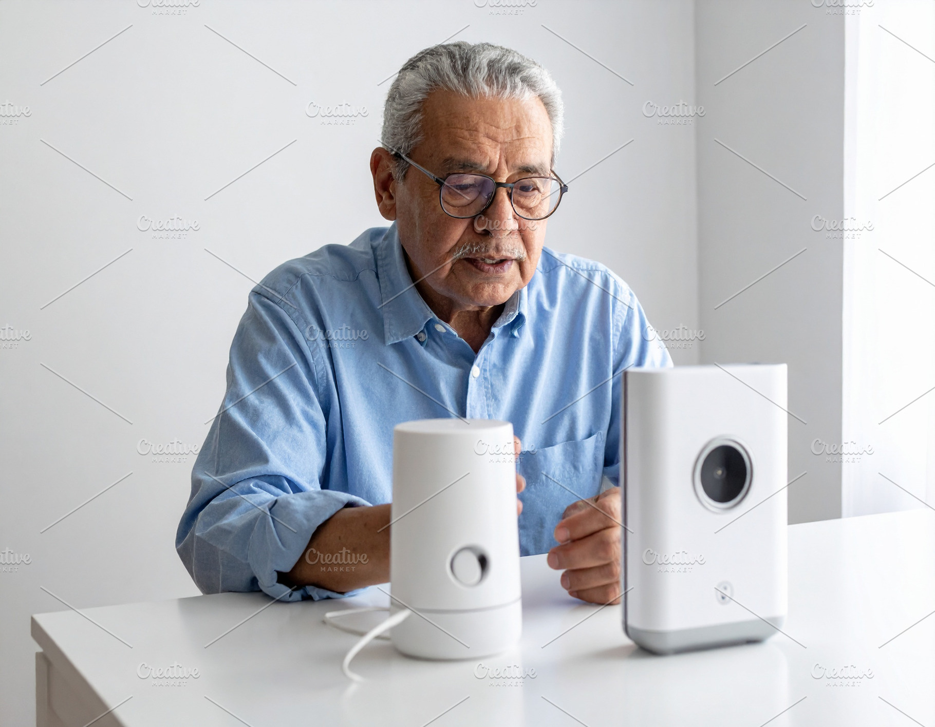 Elderly person speaking near a voice-generating device, a Person Photo by DanFLCreativo