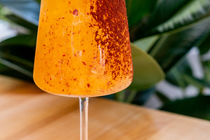 Spiced orange cocktail exotic drink glass leaves, a Food & Drink Photo by Photo Drive Studio