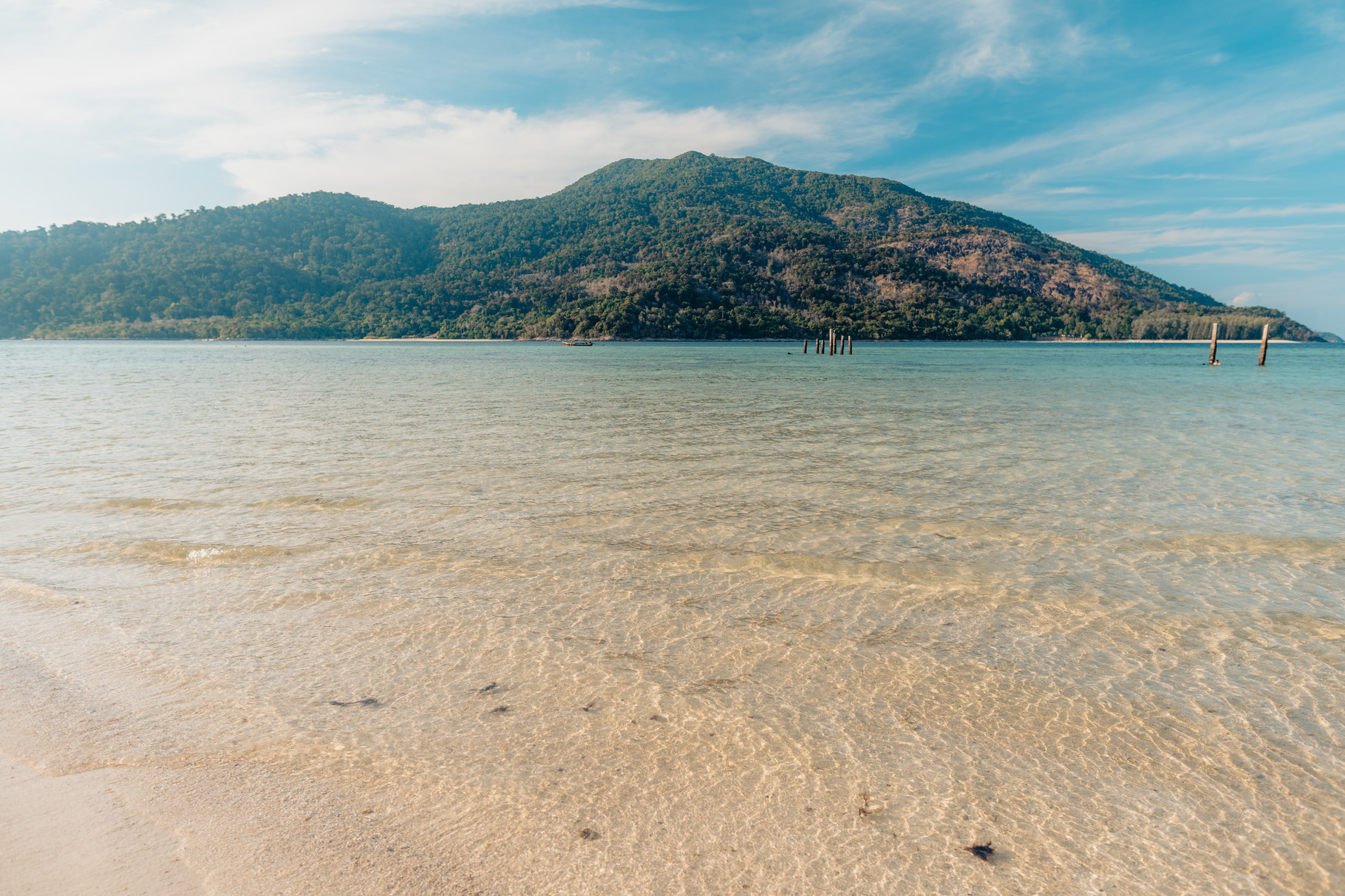 Clear sea at the beach on a tropical island, a Photo by Art Rachen
