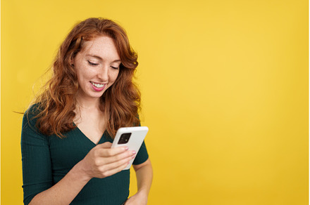 Happy redheaded woman smiling while, a Person Photo by Iván Moreno STOCK PHOTO