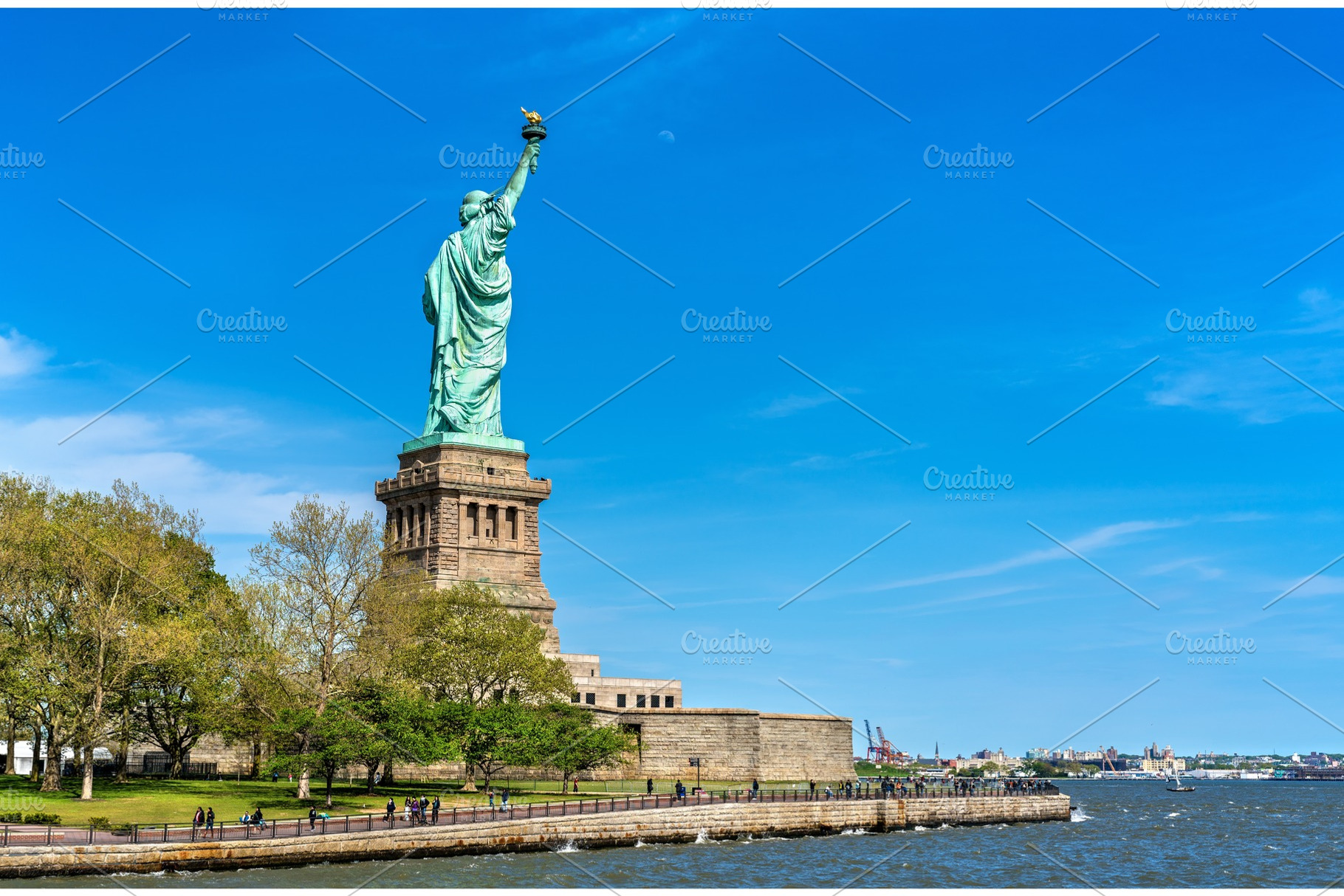 The statue of liberty on liberty island in new york city stock photo, an Architecture Photo by Leonid Andronov