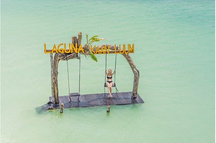 Young woman swinging over the